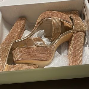 Brand new never worn beautiful rose gold/champagne sparkly platform heels!